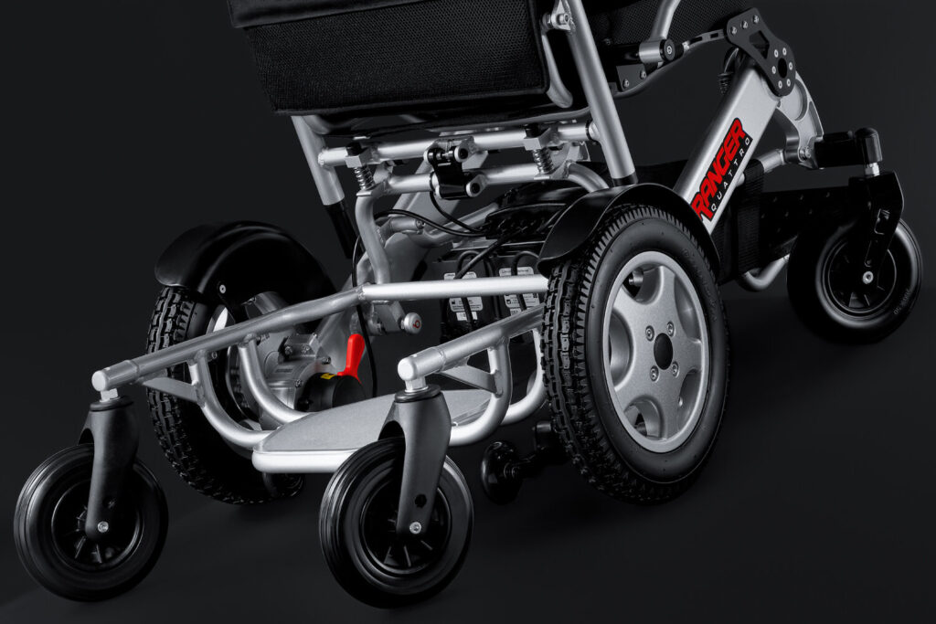 Porto Mobility Ranger Quattro XXL folding power wheelchair, low rear view of the base and wheels