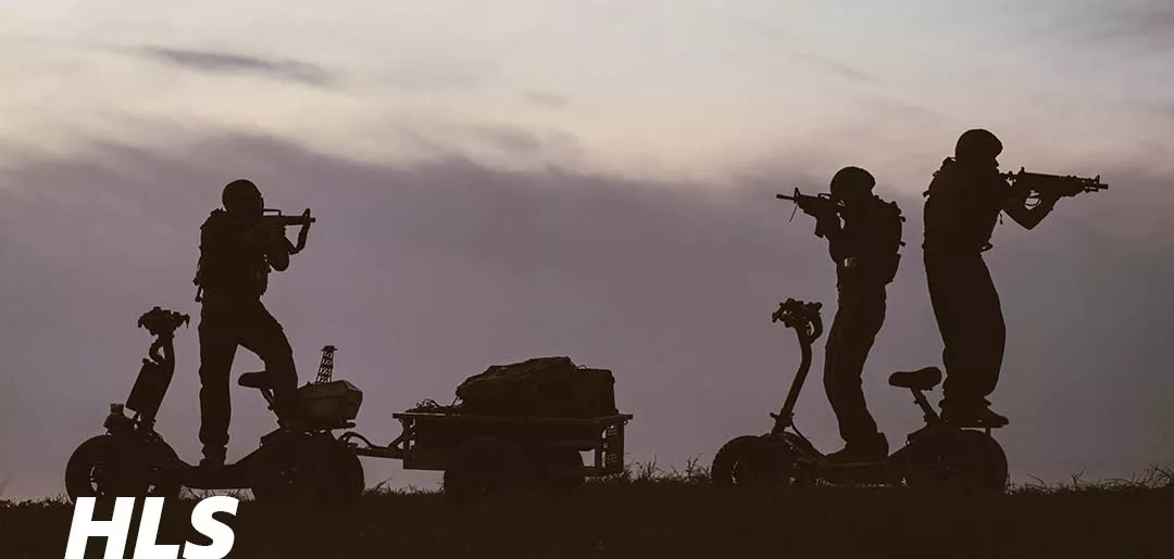 EZRaider HD4 4x4 off-road electric scooter with seat on rocky terrain during sunrise