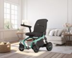 Robooter E40 folding power wheelchair in teal green in a bright living room